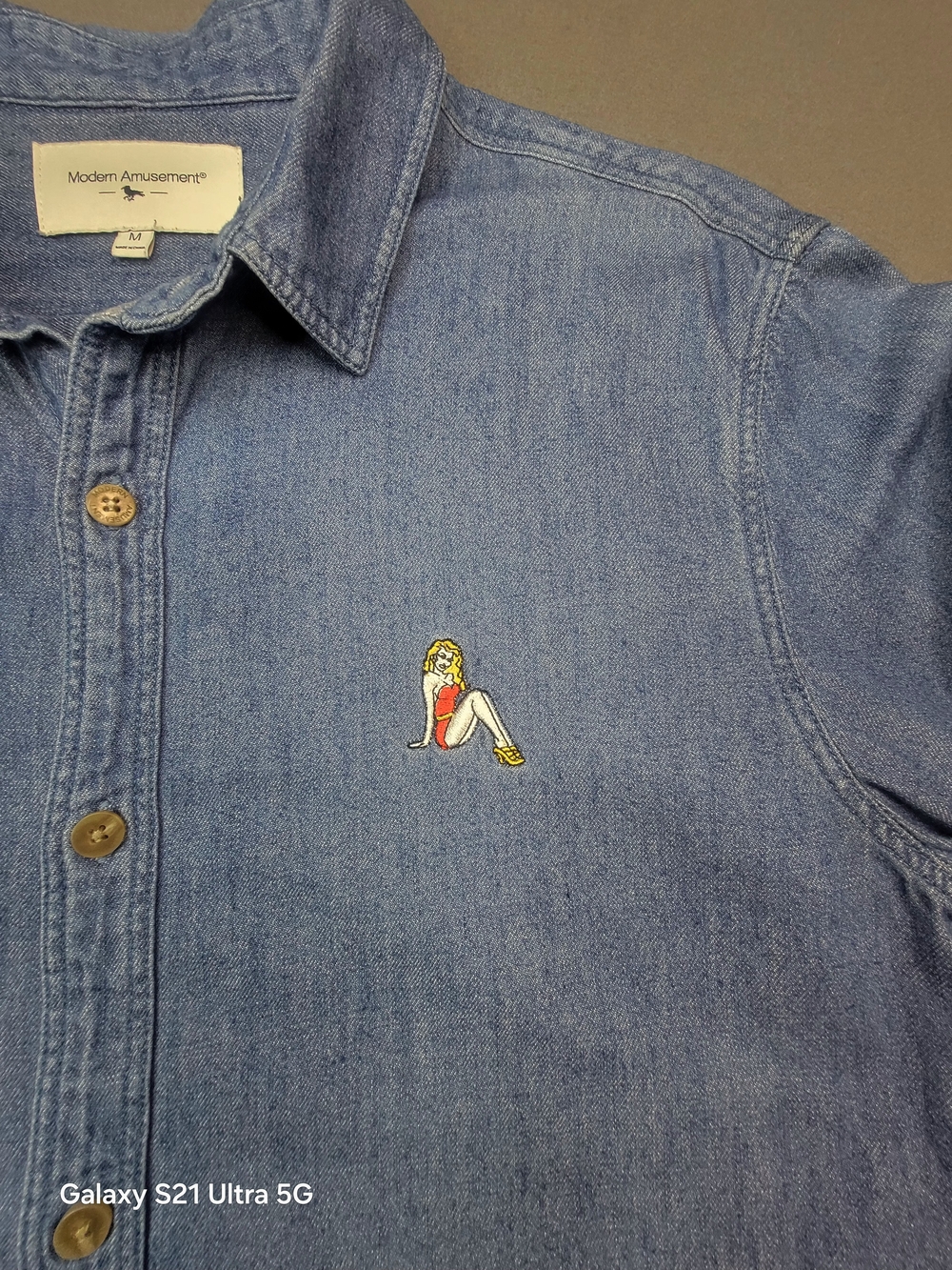 Modern Amusement Light Blue Denim Button-Down Shirt with Embroidered Motif   M